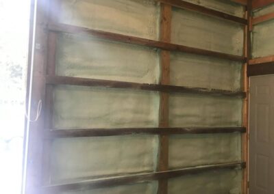 Spray foam insulation around door
